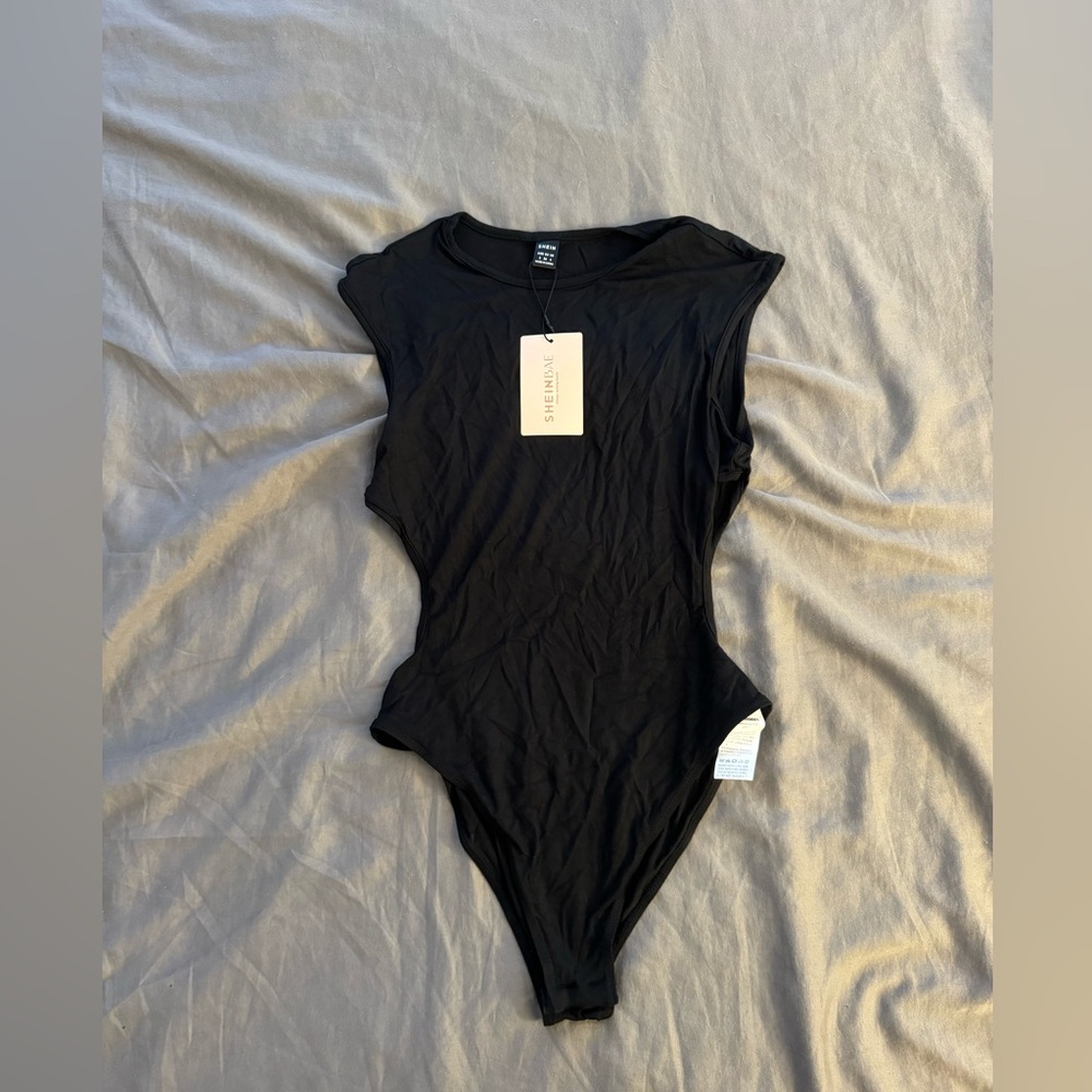 black shein body suit with cut outs on sides size small with tag